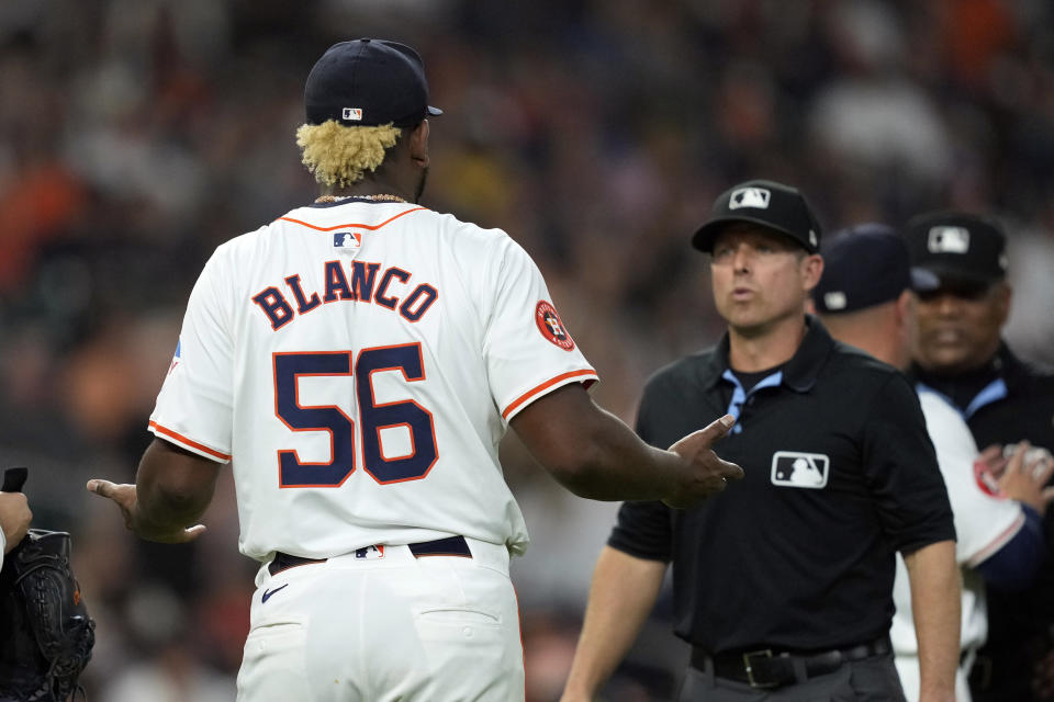 Houston Astros starting pitcher Ronel Blanco (56) talks with second base umpire Tripp Gibson after being ejected following a foreign substance check during the fourth inning of a baseball game against the Oakland Athletics Tuesday, May 14, 2024, in Houston. (AP Photo/David J. Phillip)