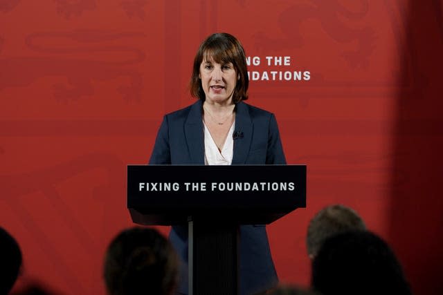 Chancellor of the Exchequer Rachel Reeves stands at a podium