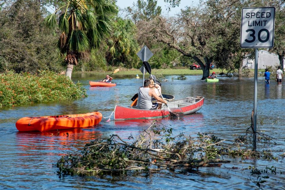 North Port residents used kayaks, canoes, and other small watercraft to retrieve their loved ones from homes flooded by Hurricane Ian.