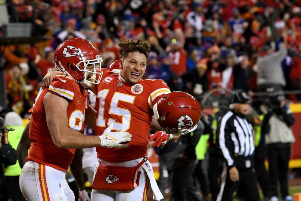 Kansas City Chiefs tight end Travis Kelce and quarterback Patrick Mahomes celebrate Kelce’s touchdown catch in overtime to win the AFC Divisional Playoff game between the Kansas City Chiefs and the Buffalo Bills at GEHA Field at Arrowhead Stadium Sunday, Dec. 23, 2022. The Chiefs defeated the Bills in overtime, 42-36.