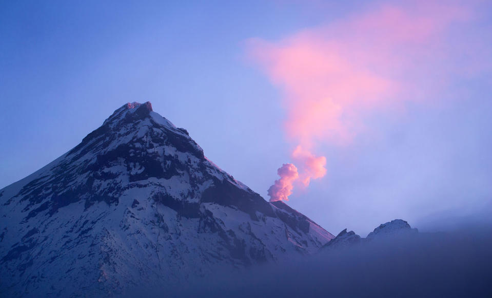 Stunning images capture ‘UFO’ clouds surrounding volcano 