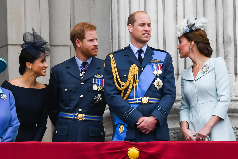 LONDON,  UNITED KINGDOM - JULY 1O:  Meghan, Duchess of Sussex, Prince Harry, Duke of Sussex, Prince William, Duke of Cambridge and Catherine, Duchess of Cambridge stand on the balcony of Buckingham Palace to view a flypast to mark the centenary of the Royal Air Force (RAF)  on July 10, 2018 in London, England. (Photo by Anwar Hussein/WireImage)