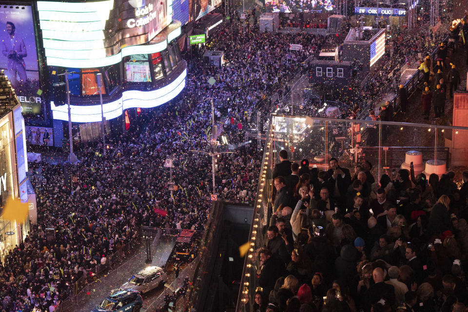 Confetti drops over the crowd as the clock strikes midnight as seen from the New York Marriott Marquis during the New Year's Eve celebration in Times Square, Monday, Jan. 1, 2024, in New York. (AP Photo/Yuki Iwamura)