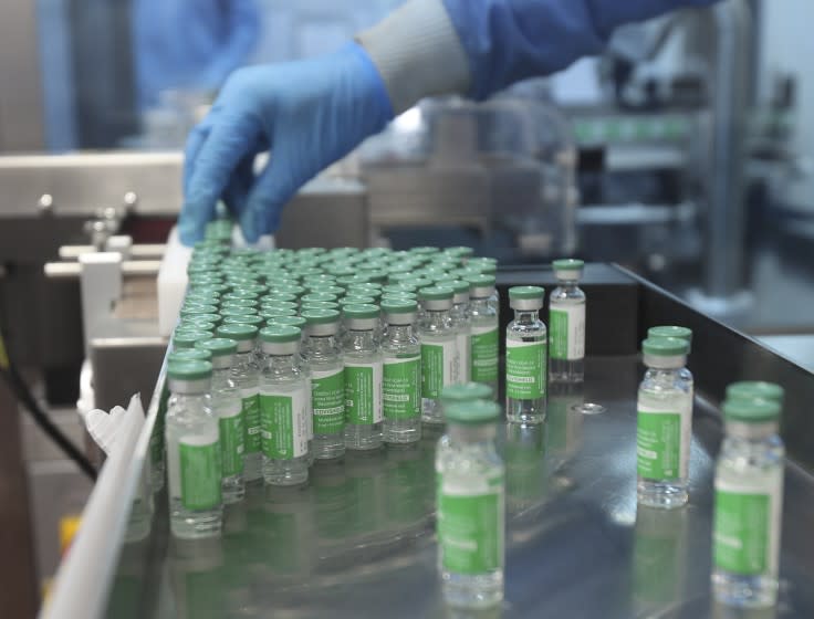 An employee works inside a laboratory at the Serum Institute of India, the world's largest vaccine maker, in Pune, India, Thursday, Jan. 21, 2021. The company is a key supplier for the U.N.-backed COVAX program that aims to distribute vaccines equitably in the world. On March 25, COVAX announced a major setback in its vaccine rollout because a surge in infections in India had caused the Serum Institute of India to cater to domestic demand, resulting in a delay in global shipments of up to 90 million doses. (AP Photo/Rafiq Maqbool)