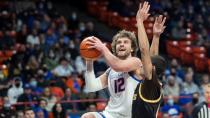 Boise State guard Max Rice drives on Wyoming guard Drake Jeffries in the first half Jan. 25 at ExtraMile Arena in Boise. The Broncos and Cowboys play again Thursday in Laramie, Wyoming.