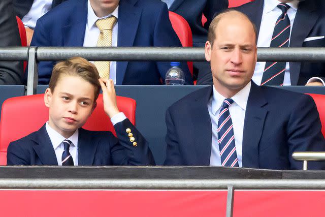 <p>Mark Pain/Alamy</p> Prince George (left) and Prince William at the FA Cup final on May 25, 2024