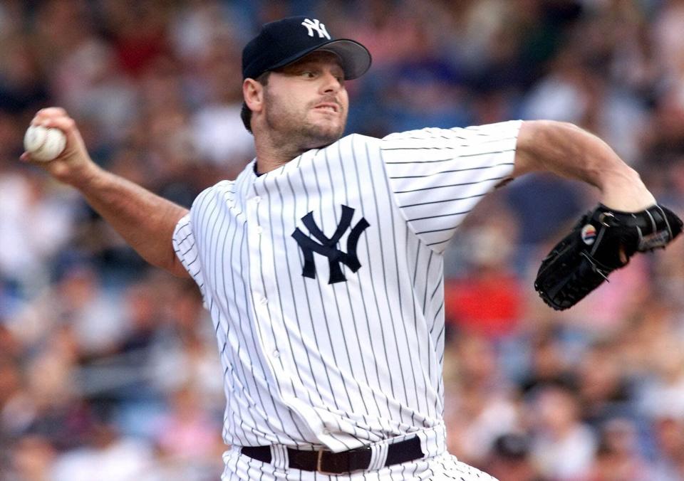 FILE - In this June 29, 2001 file photo, New York Yankees pitcher Roger Clemens throws to the plate in the first inning against the Tampa Bay Devil Rays at Yankee Stadium in New York. Barry Bonds, Roger Clemens and Curt Schilling were passed over by a Baseball Hall of Fame committee that elected former big league slugger Fred McGriff to Cooperstown on Sunday, Dec. 4, 2022.(AP Photo/Jeff Zelevansky, File)