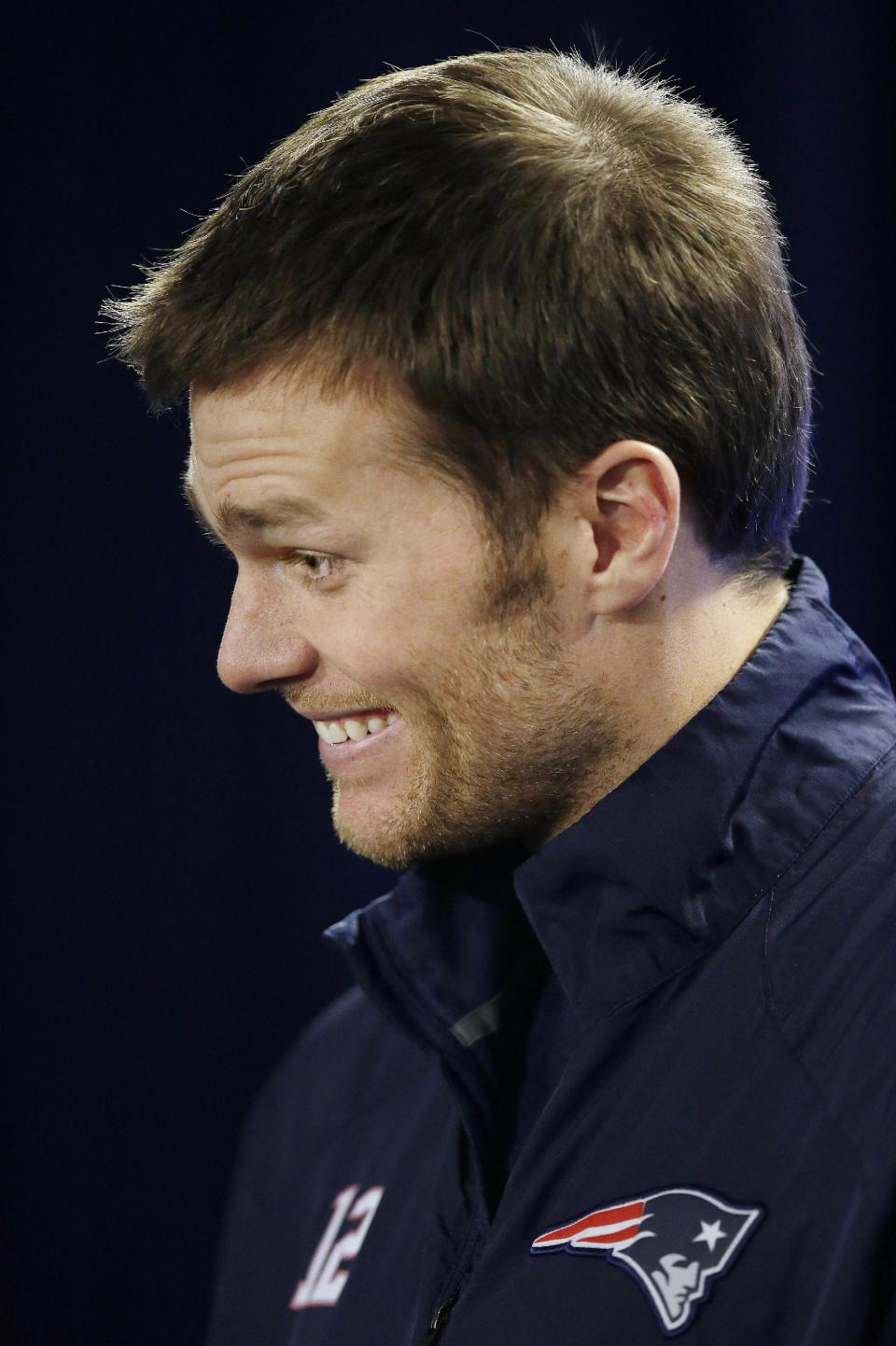 New England Patriots quarterback Tom Brady reacts to a reporter's question during an NFL football media availability at the team's training facility in Foxborough, Mass., Friday, Jan. 17, 2014. The Patriots are scheduled to play the Denver Broncos in the AFC championship game on Sunday in Denver. (AP Photo/Stephan Savoia)