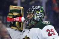 Minnesota Wild's Marc-Andre Fleury squirts water after giving up a goal to Philadelphia Flyers' Joel Farabee during the second period of an NHL hockey game, Thursday, March 23, 2023, in Philadelphia. (AP Photo/Matt Slocum)