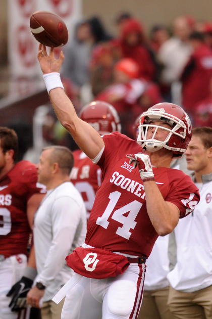 Dec 6, 2014; Norman, OK, USA; Oklahoma Sooners quarterback Cody Thomas (14) warms up prior to action against the Oklahoma State Cowboys at Gaylord Family - Oklahoma Memorial Stadium. (Mark D. Smith-USA TODAY Sports)