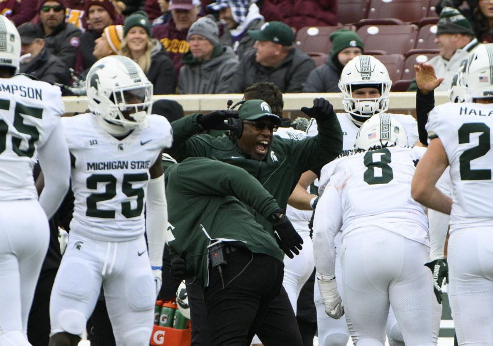 Interim head coach Harlon Barnett of the Michigan State Spartans celebrates with his players after a blocked field goal attempt in the second quarter against the Minnesota Golden Gophers at Huntington Bank Stadium on October 28, 2023 in Minneapolis, Minnesota.