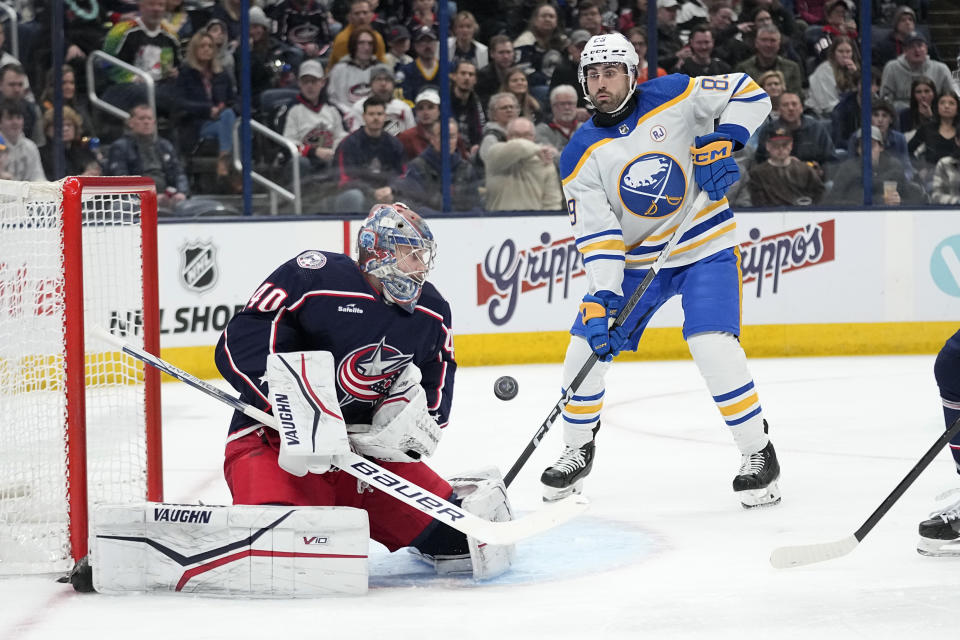 Columbus Blue Jackets goaltender Daniil Tarasov (40) blocks a shot in front of Buffalo Sabres right wing Alex Tuch during the first period of an NHL hockey game Friday, Feb. 23, 2024, in Columbus, Ohio. (AP Photo/Sue Ogrocki)