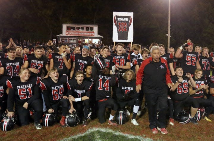 Manchester football coach Jim France celebrates with his players on Oct. 27, 2017, after earning his 382nd career win as a head coach to put him No. 1 on the Ohio all-time coaching wins list.