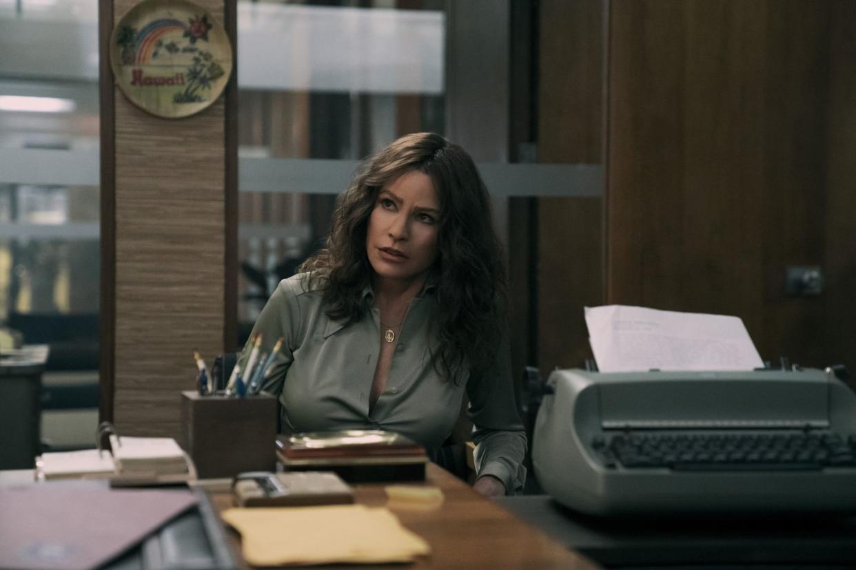 a woman sitting at a desk