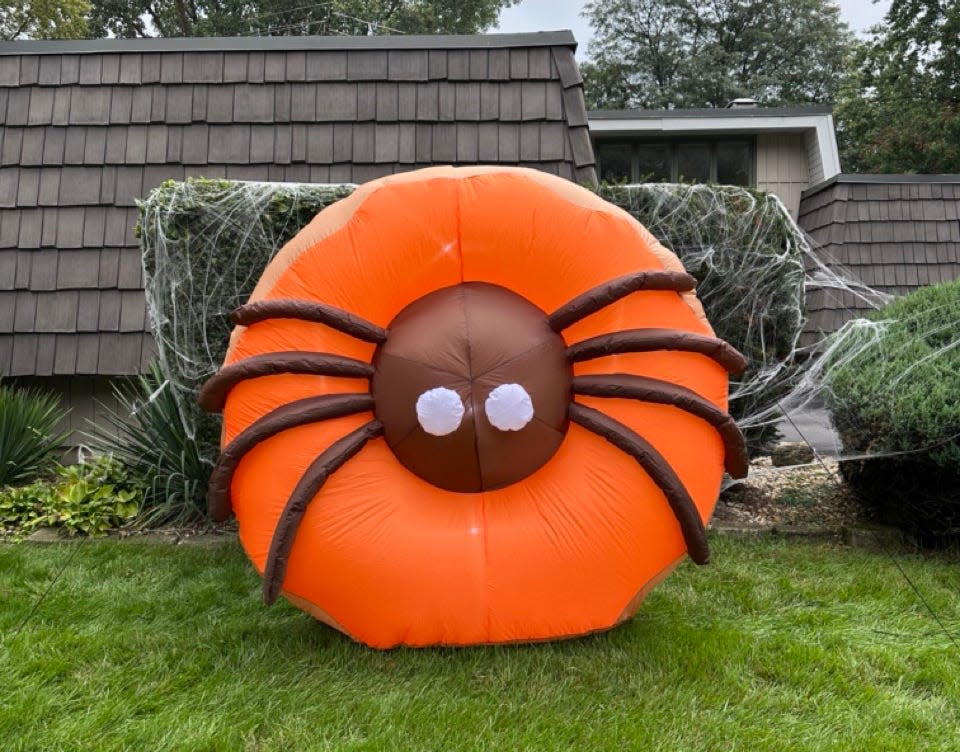 Trick-or-treaters might be running from Dunkin's new 6-foot-tall inflatable version of its Spider Donut, a new Halloween decoration.