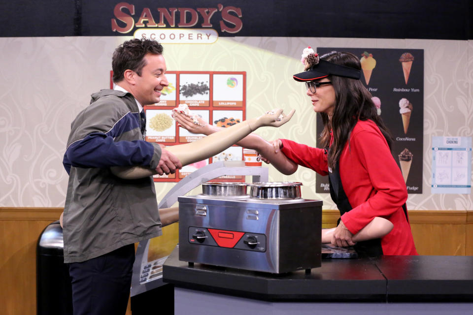 Host Jimmy Fallon and actress Sandra Bullock during the 'Fake Arms' sketch on October 28, 2015 -- (Photo by: Douglas Gorenstein/NBC/NBCU Photo Bank via Getty Images)