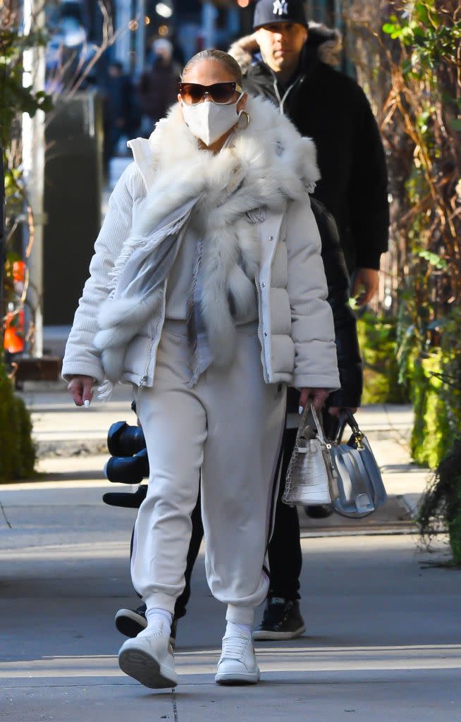 <p>The singer and actress seems to have adopted a 'no days off' approach to December style as she steps out in yet another inspired ensemble. </p><p>Jennifer Lopez wore an all-white tracksuit and puffer jacket pairing accompanied of course by a matching mask and tortoise-hued shades. </p><p>Lopez dipped into her envy worthy bag collection for a Hermès Himalayan crocodile Birkin and topped off the glacial look with a furry scarf, to top off the outfit. </p>