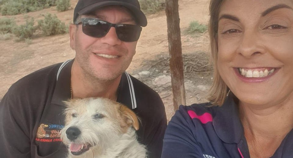 A photo of couple Steve Dowell and Vanessa Dowell with their pet dog.