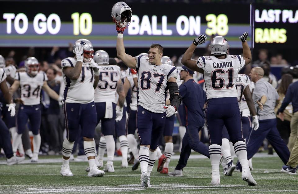 FILE - In this Feb. 3, 2019, file photo, New England Patriots' Rob Gronkowski (87) celebrates with teammates after the NFL Super Bowl 53 football game against the Los Angeles Rams in Atlanta. The Patriots won 13-3. Gronkowski says he is retiring from the NFL after nine seasons. Gronkowski announced his decision via a post on Instagram Sunday, March 24, 2019, saying that a few months shy of this 30th birthday “its time to move forward and move forward with a big smile.” (AP Photo/Carolyn Kaster, File)