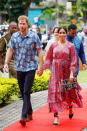 <p>Meghan wore a pink silk frock embellished with ruffles and pom poms from the label Figure. The “Frederica” floral wrap dress, as it’s known, retails for $2,877 and finished at her ankles to reveal a pair of black espadrilles. Photo: Getty </p>