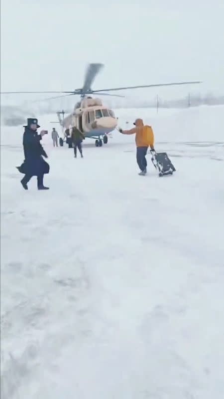 Tourists stranded by avalanches lifted to safety by helicopter, in Burqin County