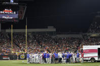 The Buffalo Bills players pray for teammate Damar Hamlin during the first half of an NFL football game against the Cincinnati Bengals, Monday, Jan. 2, 2023, in Cincinnati. The game has been postponed after Buffalo Bills' Damar Hamlin collapsed, NFL Commissioner Roger Goodell announced. (AP Photo/Joshua A. Bickel)