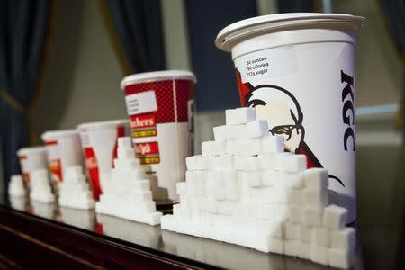 A 64-ounce drink is displayed alongside other soft drink cup sizes at a news conference at City Hall in New York, May 31, 2012. REUTERS/Andrew Burton