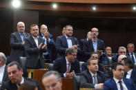 Members of Hezbollah parliamentary bloc gesture after Nabih Berri is re-elected as Lebanon's parliamentary speaker, as Lebanon's newly elected parliament convenes for the first time to elect a speaker and deputy speaker in Beirut, Lebanon May 23, 2018. Lebanese Parliament/Handout via REUTERS