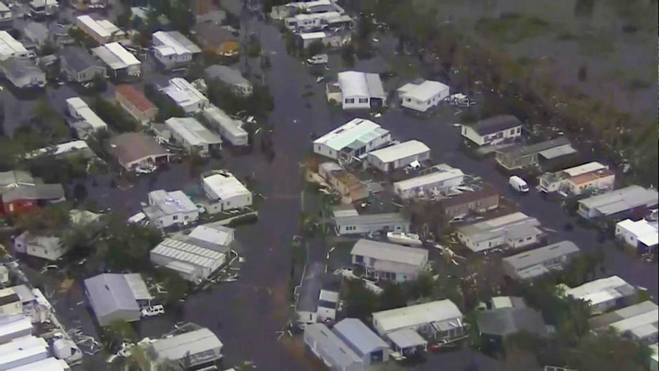 An aerial view of flooded homes in Lee County, Fla.