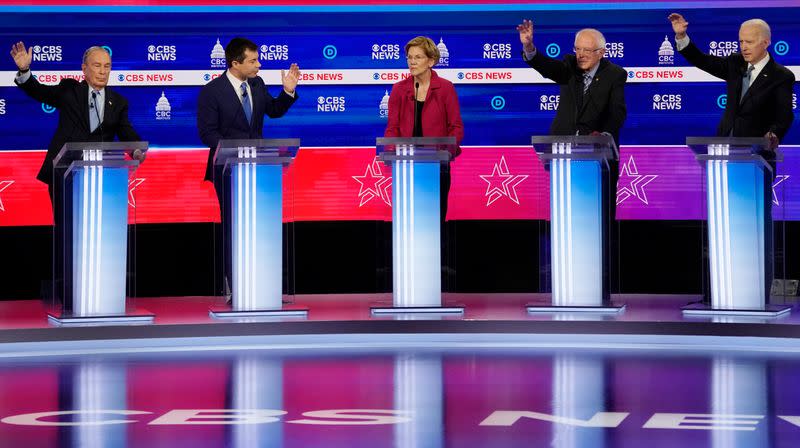 Candidates discuss an issue during the tenth Democratic 2020 presidential debate at the Gaillard Center in Charleston, South Carolina, U.S.