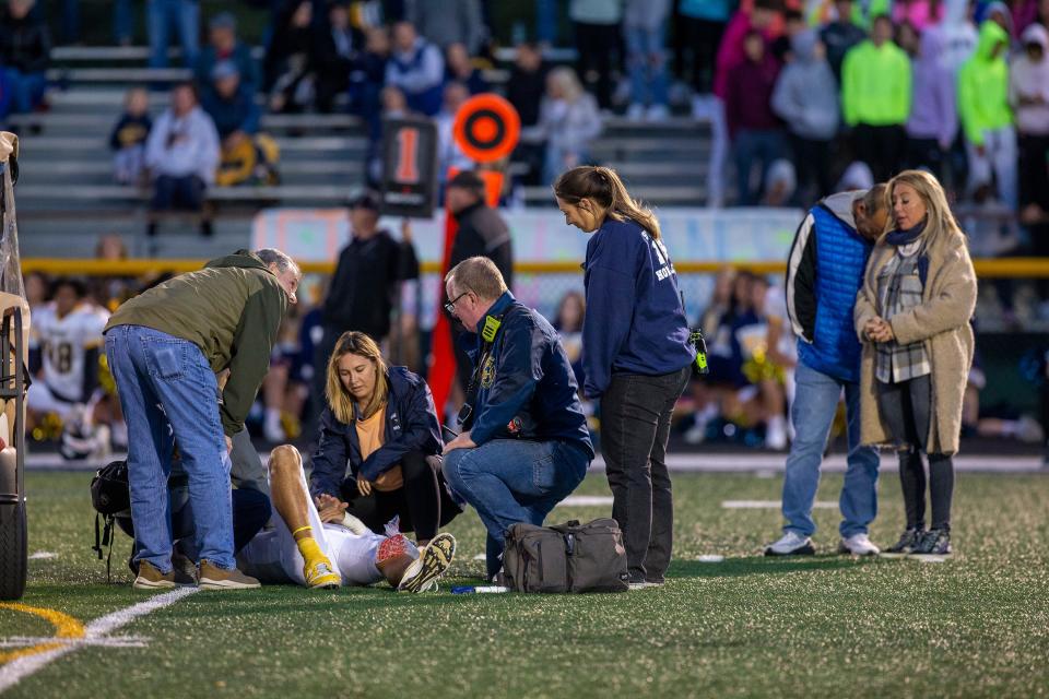 Marlboro's quarterback AJ Schwartz is injured and taken to a waiting ambulance during the first half of the Marlboro vs. Howell high school football game at Howell High School in Farmingdale, NJ Friday, September 23, 2022.