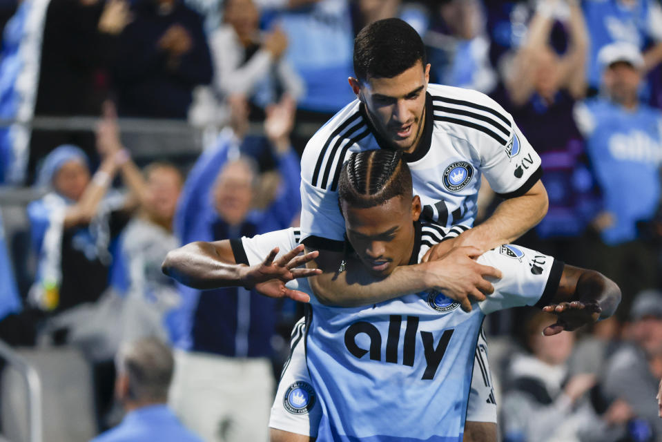 Charlotte FC forward Kerwin Vargas, front, celebrates with forward Liel Abada after scoring a goal against Toronto FC during the first half of an MLS soccer match in Charlotte, N.C., Saturday, April 13, 2024. (AP Photo/Nell Redmond)
