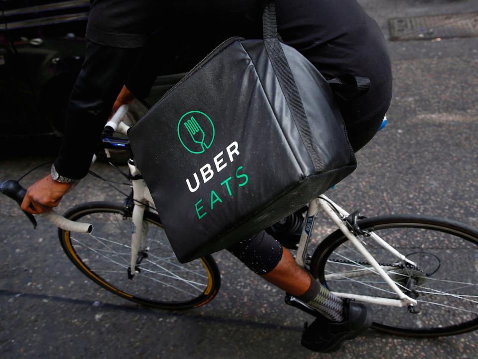 An UberEATS food delivery courier rides his bike in London, Britain September 7, 2016. Picture taken September 7, 2016. To match FOOD-DELIVERY/