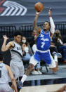 Los Angeles Lakers guard Ben McLemore, right, shoots over Portland Trail Blazers guard Anfernee Simons during the first half of an NBA basketball game in Portland, Ore., Friday, May 7, 2021. (AP Photo/Craig Mitchelldyer)