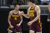 Minnesota guard Braeden Carrington (4) reacts after being fouled during the second half of an NCAA college basketball game against Purdue, Sunday, Dec. 4, 2022, in West Lafayette, Ind. (AP Photo/Doug McSchooler)