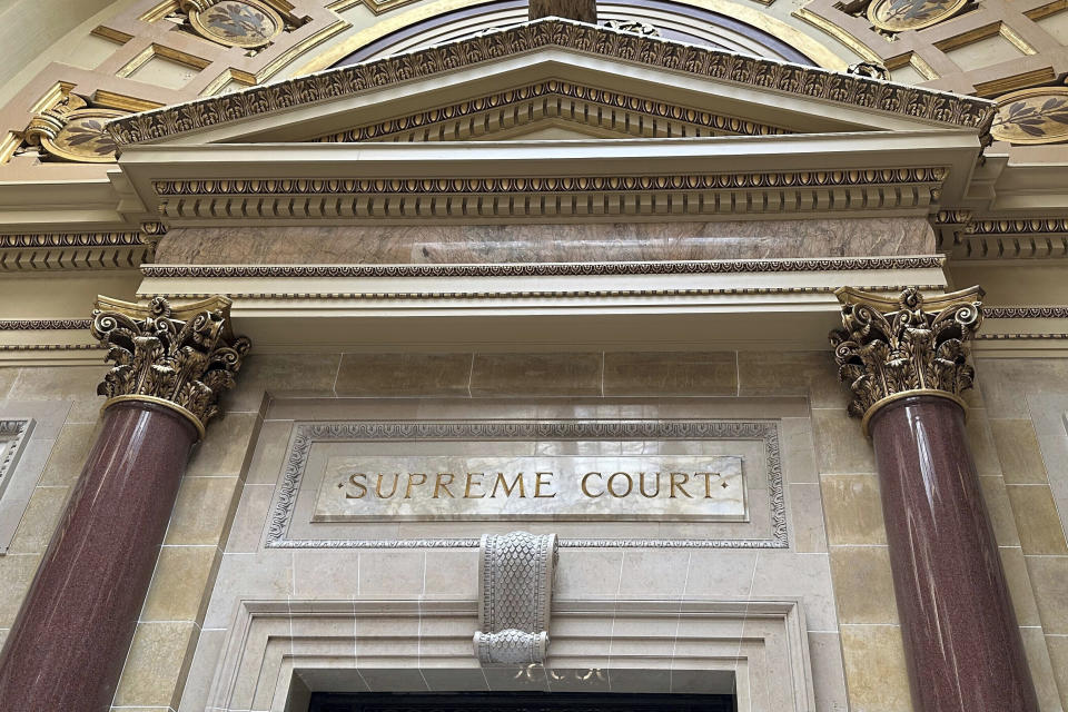 FILE - The entrance to the Wisconsin Supreme Court chambers is seen inside the state Capitol in Madison, Wis., March 14, 2024. The Wisconsin Supreme Court late Tuesday, June 11, kept in place for now a lower court's ruling banning the use of mobile voting sites in the upcoming presidential election, a win for Republicans. (AP Photo/Todd Richmond, File)