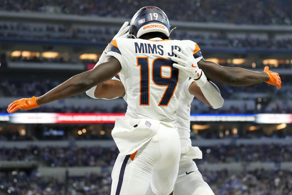 Denver Broncos wide receiver Marvin Mims Jr. (19) celebrates with teammates after scoring a touchdown against the Indianapolis Colts during the second quarter of a preseason NFL football game, Sunday, Aug. 11, 2024, in Westfield, Ind. (AP Photo/AJ Mast)