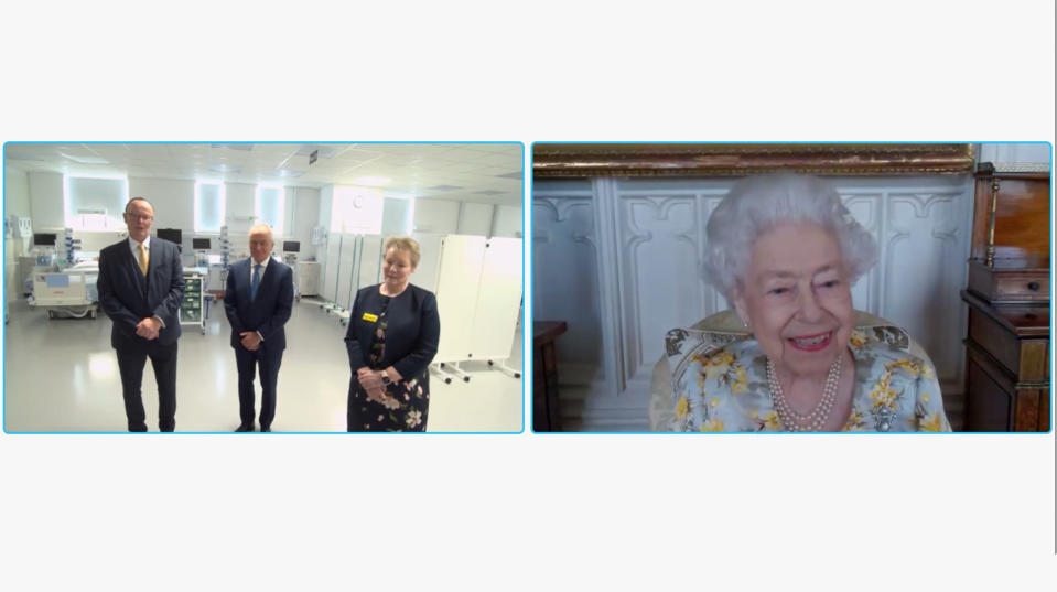 In this image from video issued by Buckingham Palace on Sunday, April 10, 2022, Britain's Queen Elizabeth II speaks to Jeff Barley, project director of the construction of the unit; Paul Chandler, managing director, Wates Group and Jackie Sullivan, chief executive, The Royal London Hospital during a video link call and virtual visit to the Royal London Hospital on Wednesday April 6, 2022, to mark the official opening of the hospital's Queen Elizabeth Unit. (Buckingham Palace via AP)