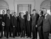 <p>President Kennedy stands with a group of leaders of the March on Washington at the White House in Washington. Immediately after the march, they discussed civil rights legislation that was finally inching through Congress. From second left are Whitney Young, National Urban League; Dr. Martin Luther King, Christian Leadership Conference; John Lewis, Student Non-violent Coordinating Committee, partially obscured; Rabbi Joachim Prinz, American Jewish Congress; Dr. Eugene P. Donnaly, National Council of Churches; A. Philip Randolph, AFL-CIO vice president; Kennedy; Walter Reuther, United Auto Workers; Vice President Lyndon B. Johnson, partially obscured, and Roy Wilkins, NAACP. (AP Photo) </p>