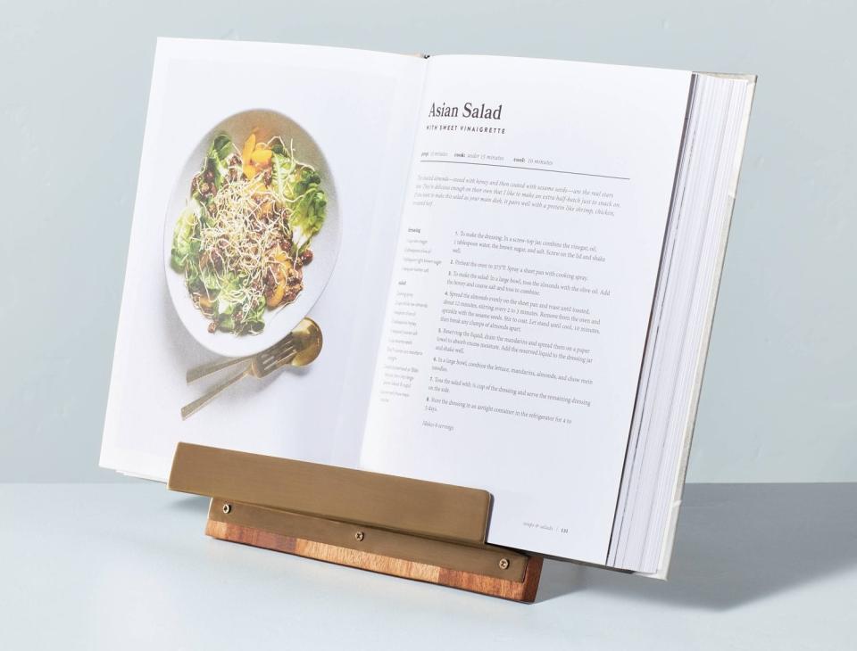 The holder with an open cookbook on it