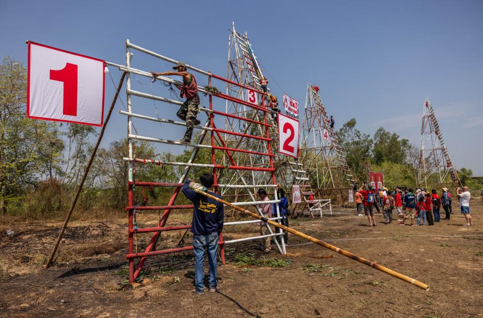 Participants prepare to launch a home-made rocket during the "Bun Bang Fai" rocket festival on May 12, 2024 in Yasothon, Thailand