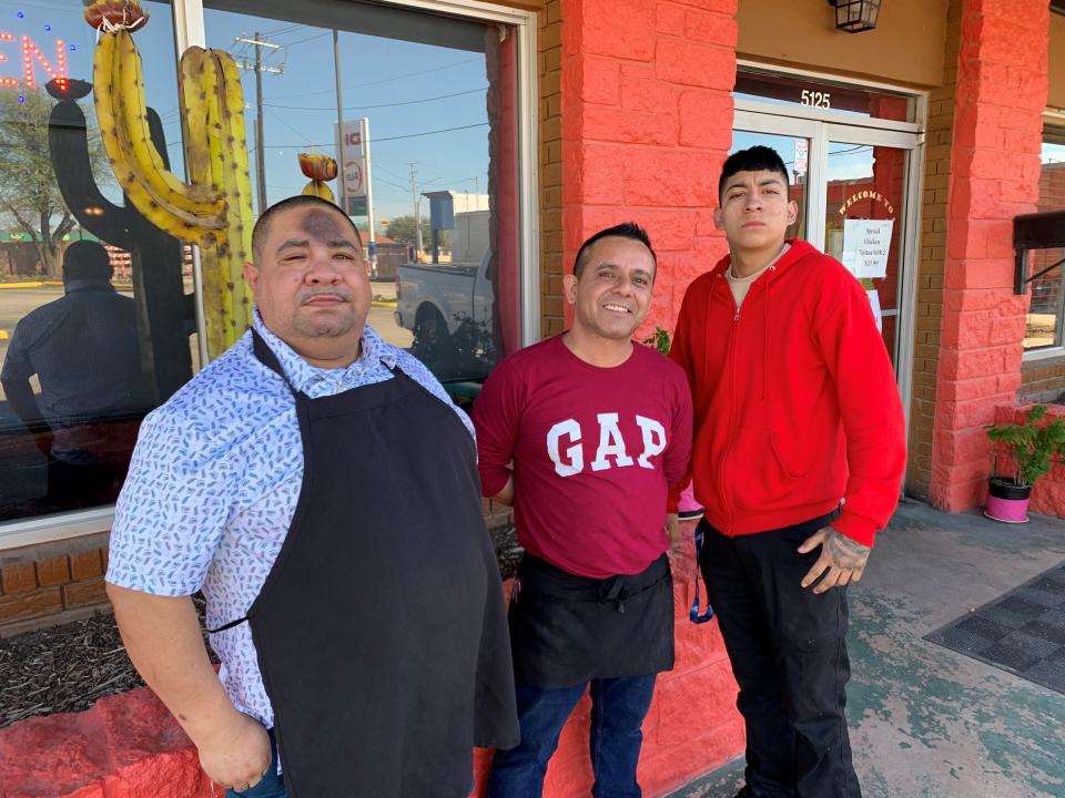 Owner Adrian Lopez stands with staff, Jorge Garcia and Mario Zavala, outside Oscar's #2 on Buffalo Gap Road on Wednesday.