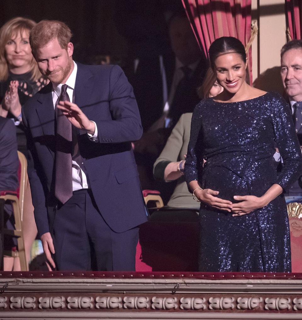 Harry and Meghan wave at a special Cirque du Soleil performance.