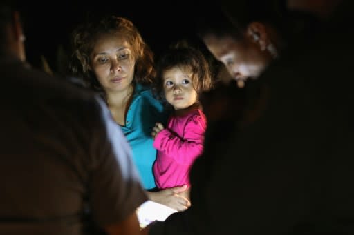 Two-year-old Yanela Varela and her mother are taken into custody near the US-Mexico border in McAllen, Texas on June 12, 2018