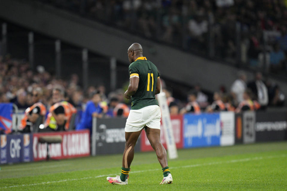 South Africa's Makazole Mapimpi leaves the field after a head clash during the Rugby World Cup Pool B match between South Africa and Tonga at the Marseille's Stade Velodrome, in Marseille, France Sunday, Oct. 1, 2023. (AP Photo/Daniel Cole)