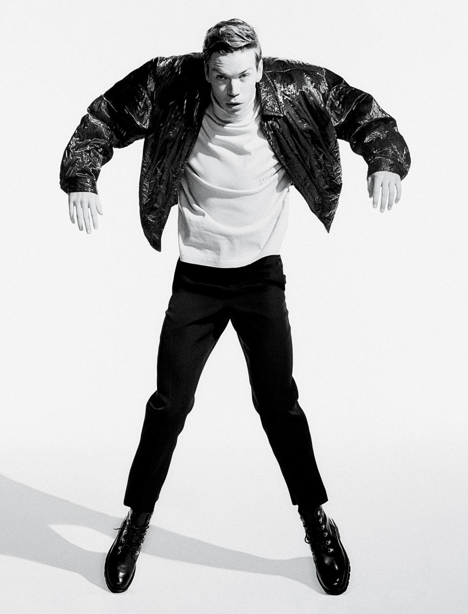 <cite class="credit">Jacket, $1,710, by Dries Van Noten / Turtleneck, $170, by Ambush / Pants, $960, by Jil Sander / Boots, $370, by Grenson</cite>