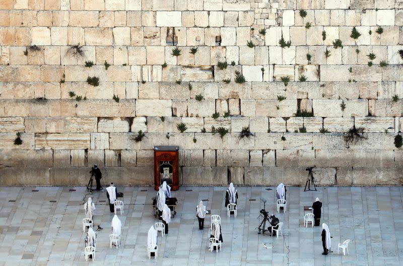 Jewish worshippers pray at Western Wall on Passover amid COVID-19 outbreak in Jerusalem's Old City