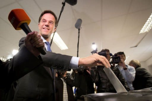 Dutch Prime Minister and leader of the conservative Liberal VVD party Mark Rutte casts his ballot on September 12, 2012 at a polling station in the Hague for the country's general election. The Netherlands voted in crunch polls Wednesday seen as a barometer of anti-European sentiment after a riveting campaign that has shaped into a tight race between two pro-Europe parties