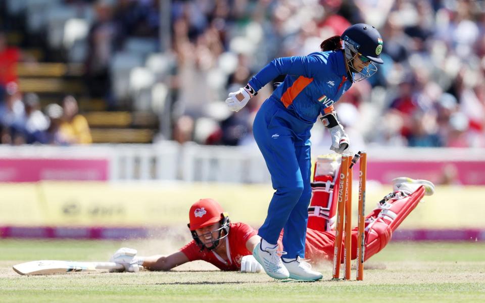 Taniyaa Bhatia of Team India runs out Nat Sciver of Team England - Matthew Lewis/Getty Images