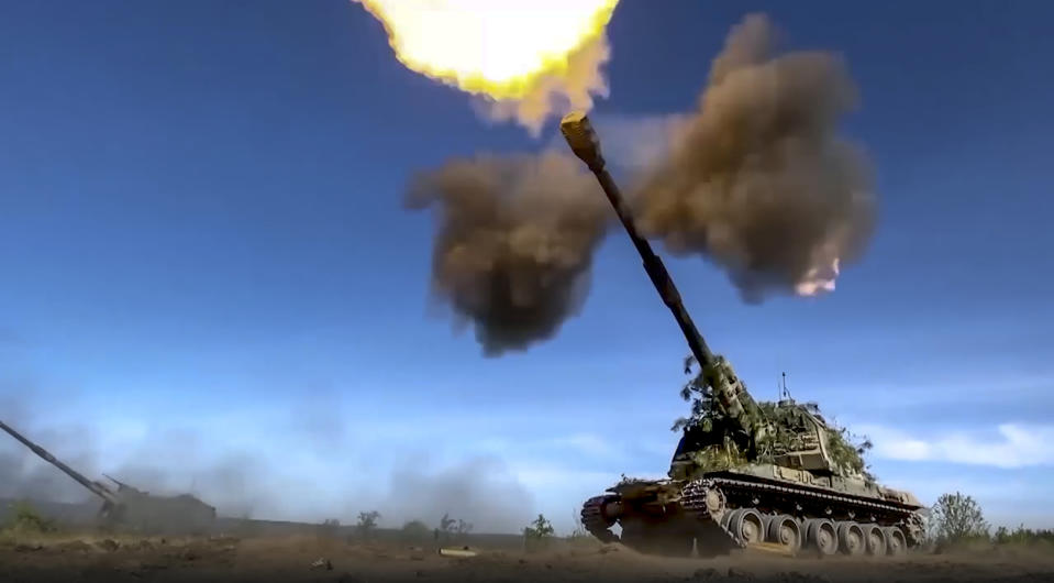 This photo taken from video released by Russian Defense Ministry Press Service on Monday, June 5, 2023 shows a Russian self-propelled gun firing towards Ukrainian positions at an undisclosed location. (Russian Defense Ministry Press Service via AP)